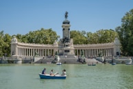 a couple of people in a small boat in the water