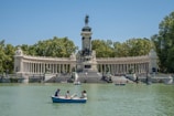 a couple of people in a small boat in the water