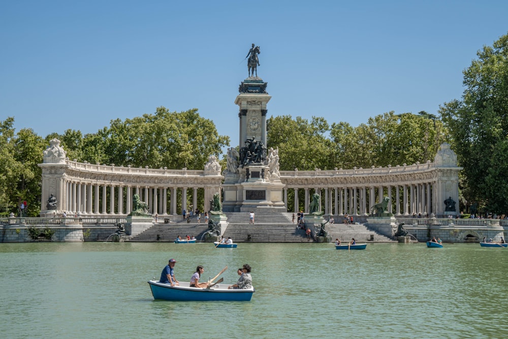 a couple of people in a small boat in the water