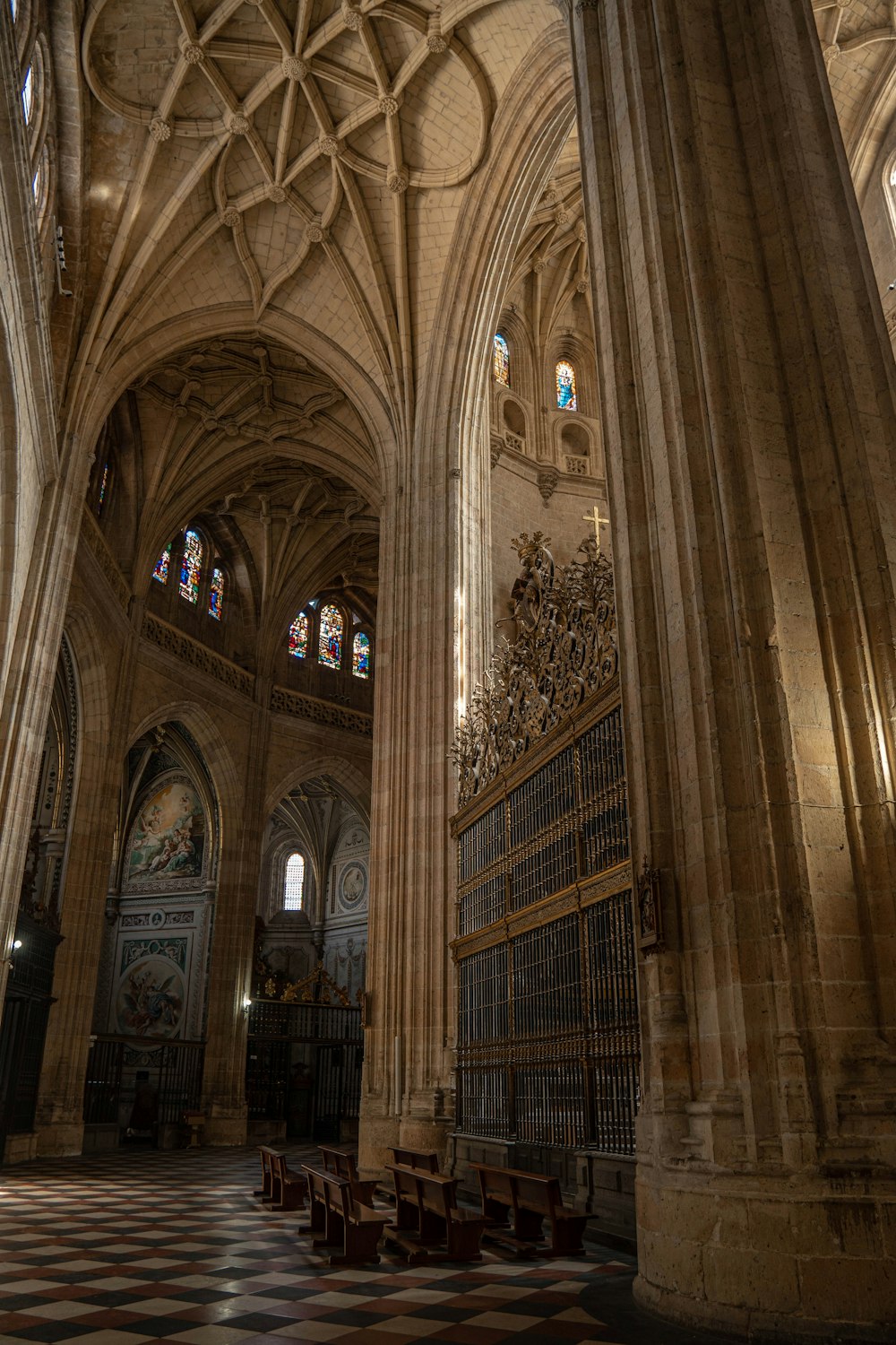 the interior of a cathedral with a checkered floor