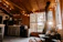 Cozy interior of the modern container cabin with warm lighting and natural wood accents.