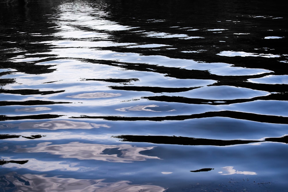 a body of water that has some clouds in it