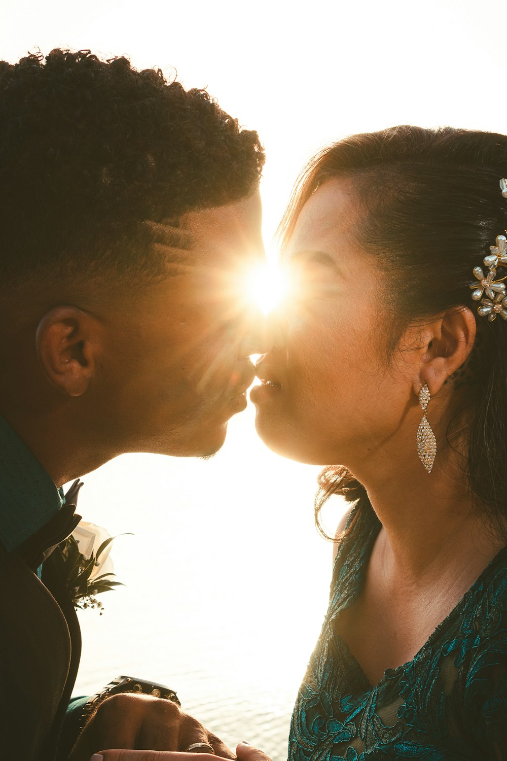 a man and a woman kissing each other