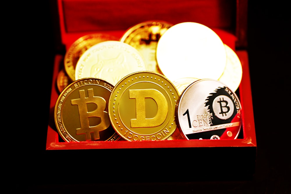 a red box filled with different types of bitcoins