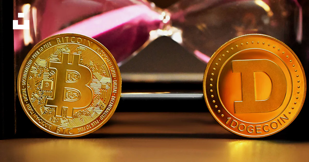 Two bitcoins sitting next to each other on a table photo – Free ...