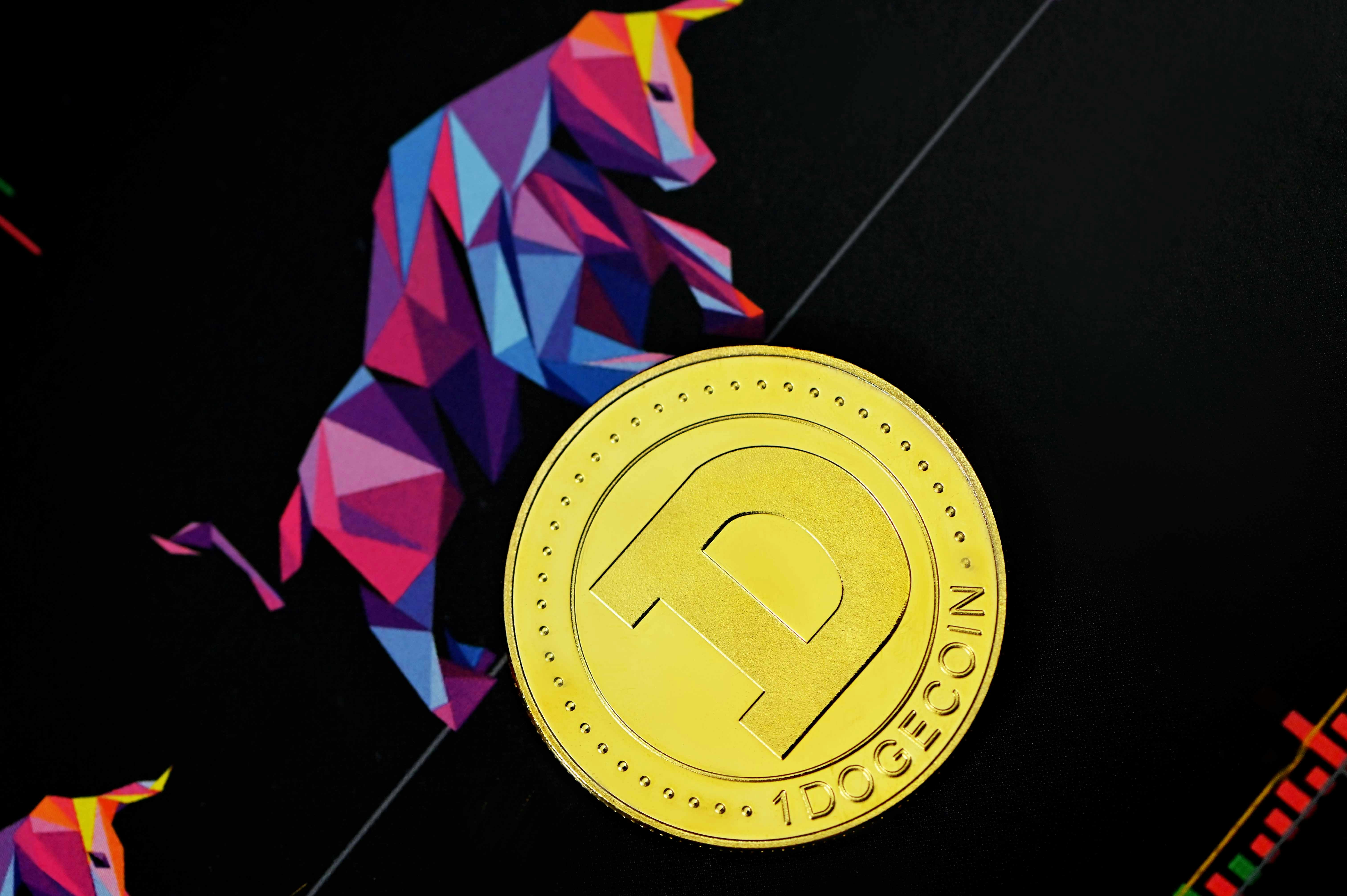 a close up of a gold coin on a black surface
