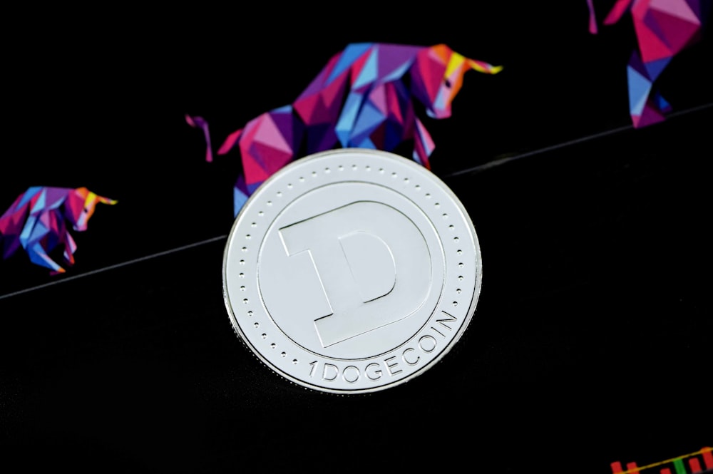 a close up of a coin on a black surface