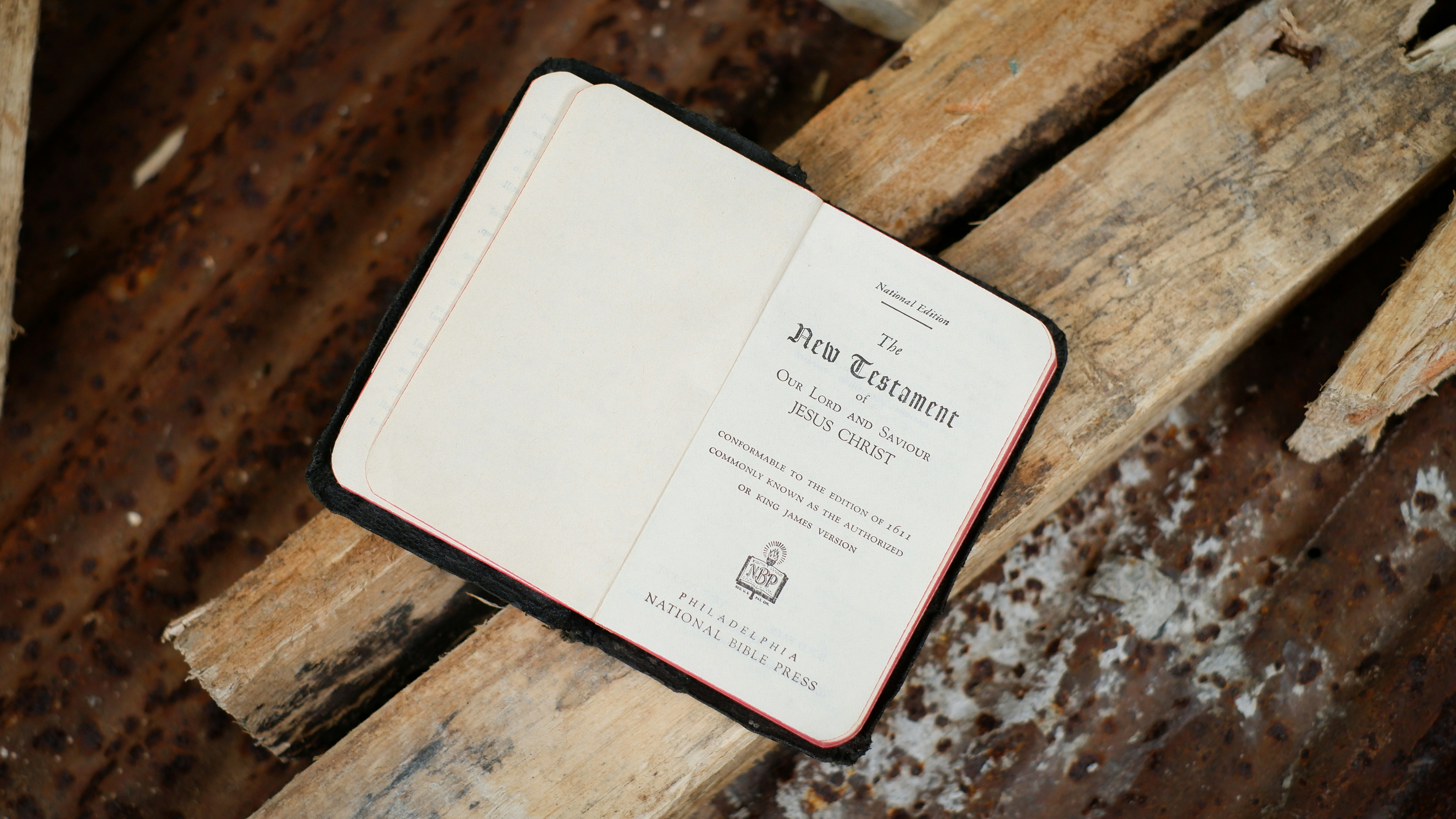a book sitting on top of a wooden bench