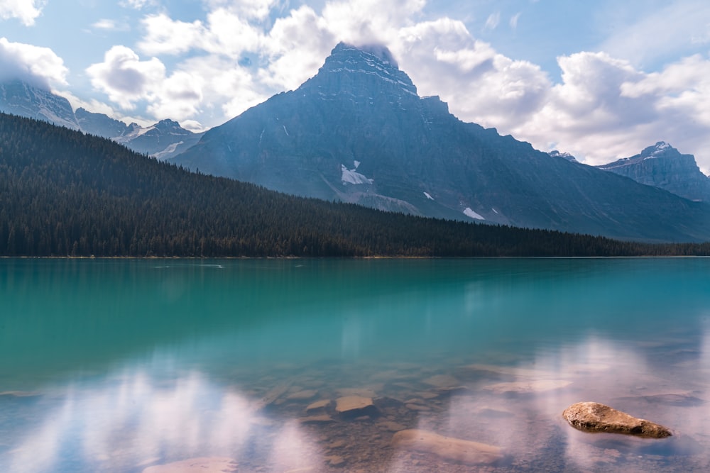 a lake with a mountain in the background