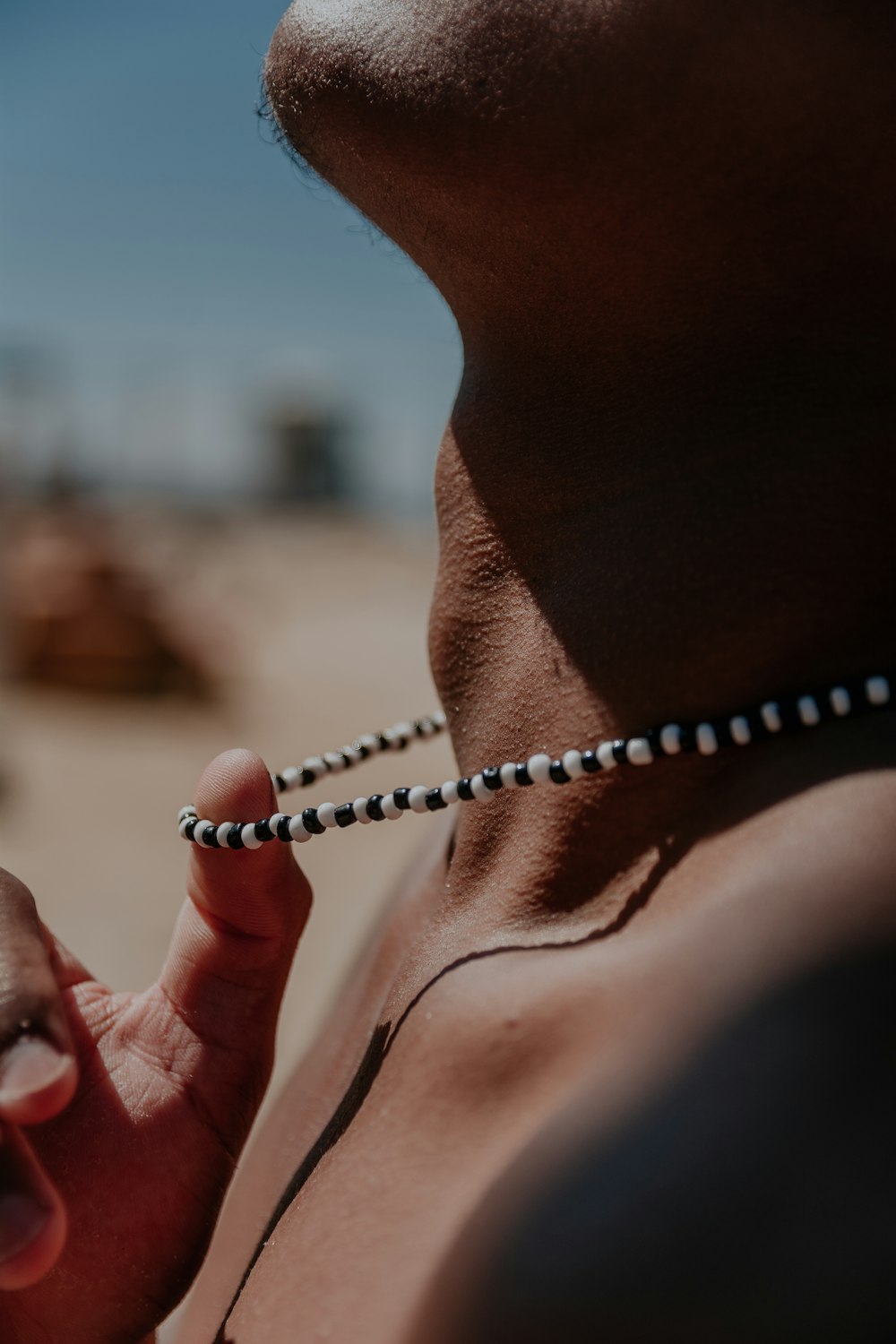 a person holding a rosary in their hand