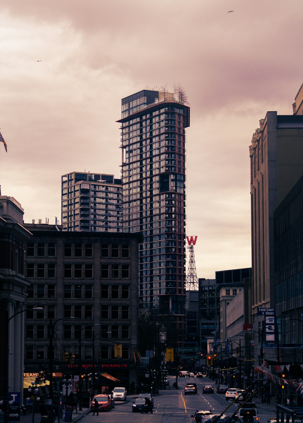 a city street filled with lots of tall buildings