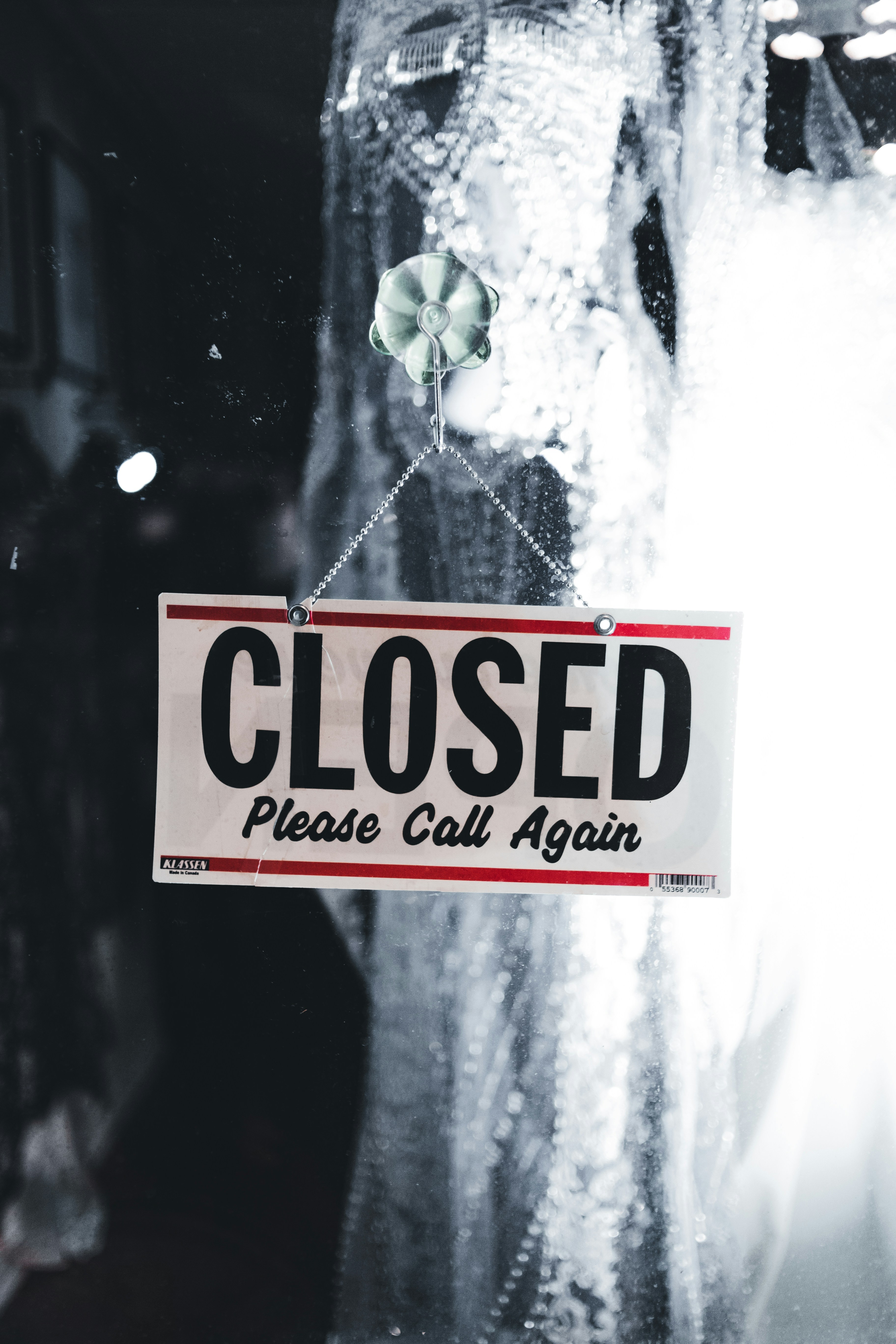 a close up of a closed sign on a window