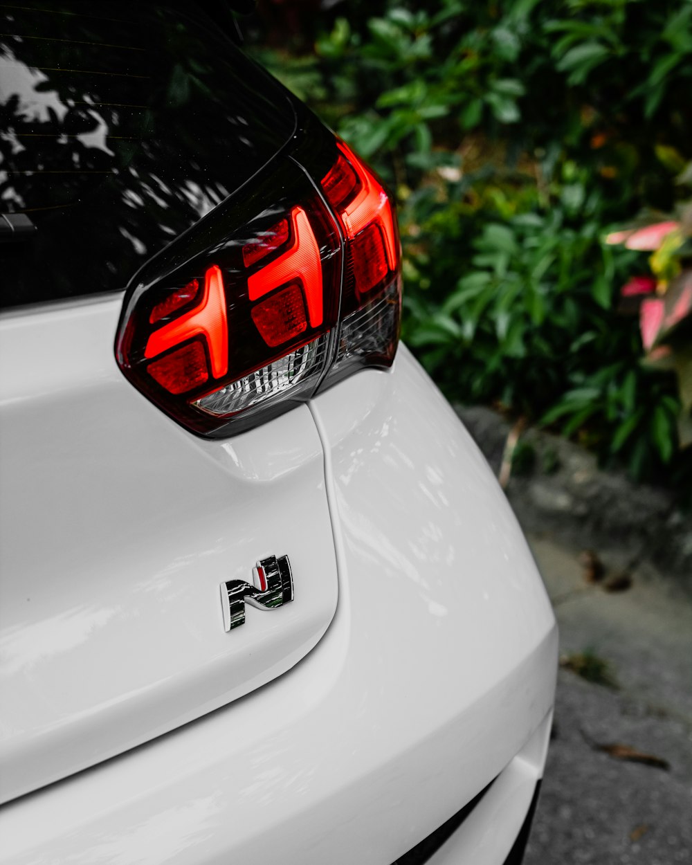 a close up of the tail lights of a white car