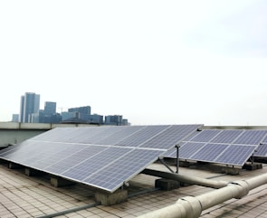 a row of solar panels sitting on top of a roof