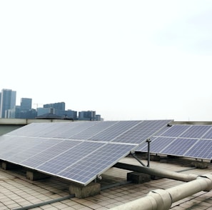 a row of solar panels sitting on top of a roof