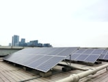 a row of solar panels sitting on top of a roof