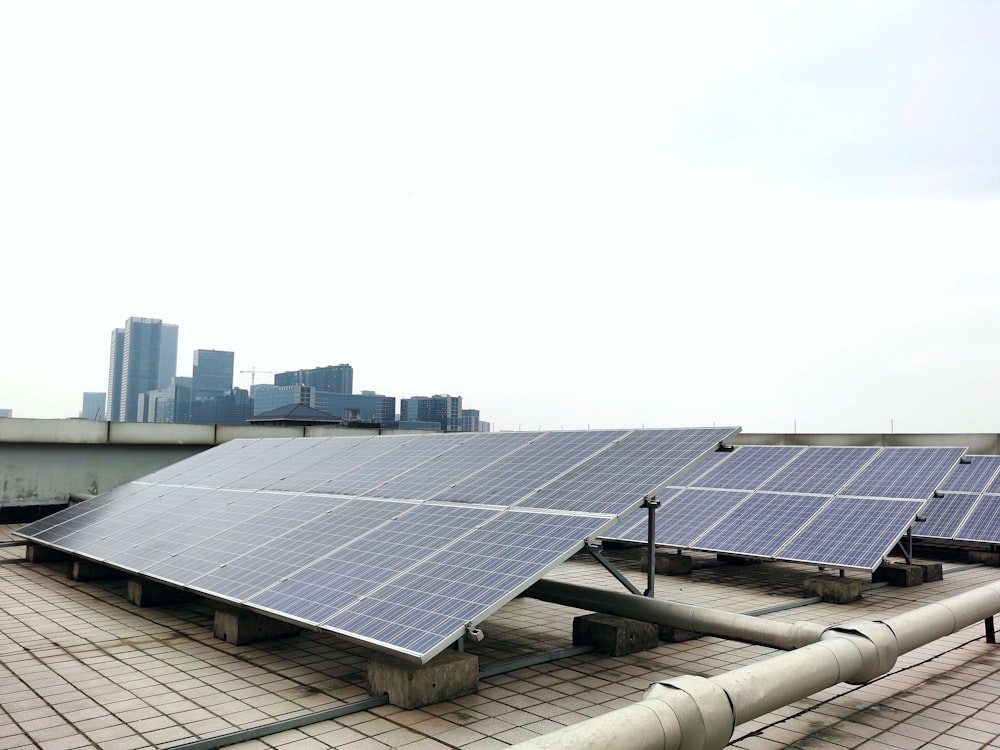 a row of solar panels sitting on top of a roof