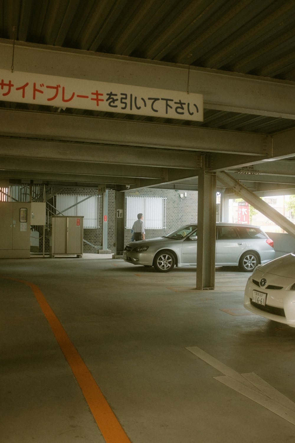 a parking garage with cars parked in it