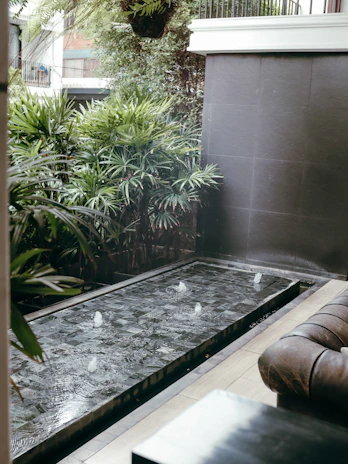 An elegant outdoor space featuring fountain cover and pump.