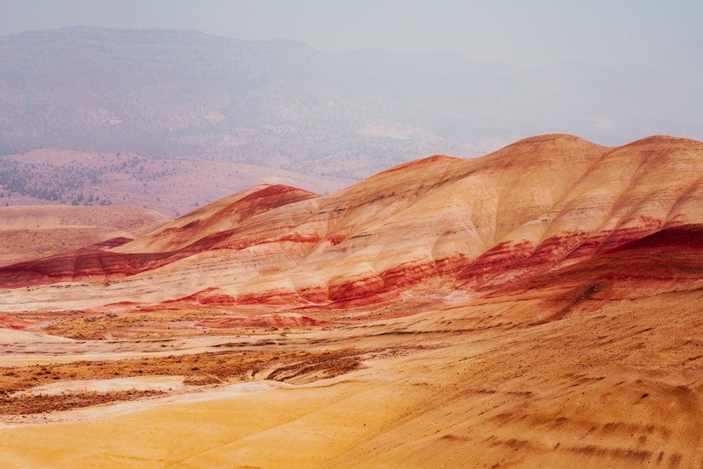 a group of hills that have been painted red and yellow