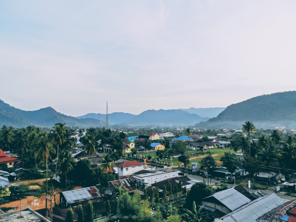 a small town with mountains in the background