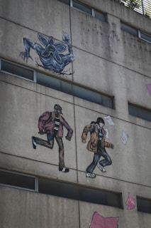 a building with a mural of two people on the side of it