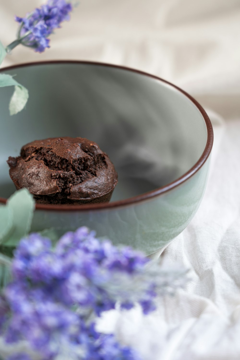 a bowl with a chocolate cookie in it