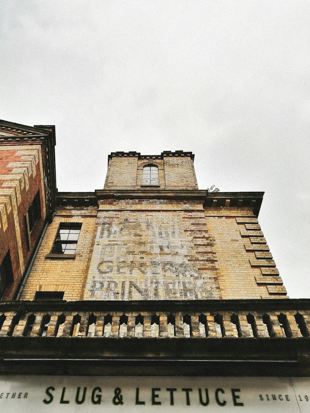 a tall building with a sign on the side of it