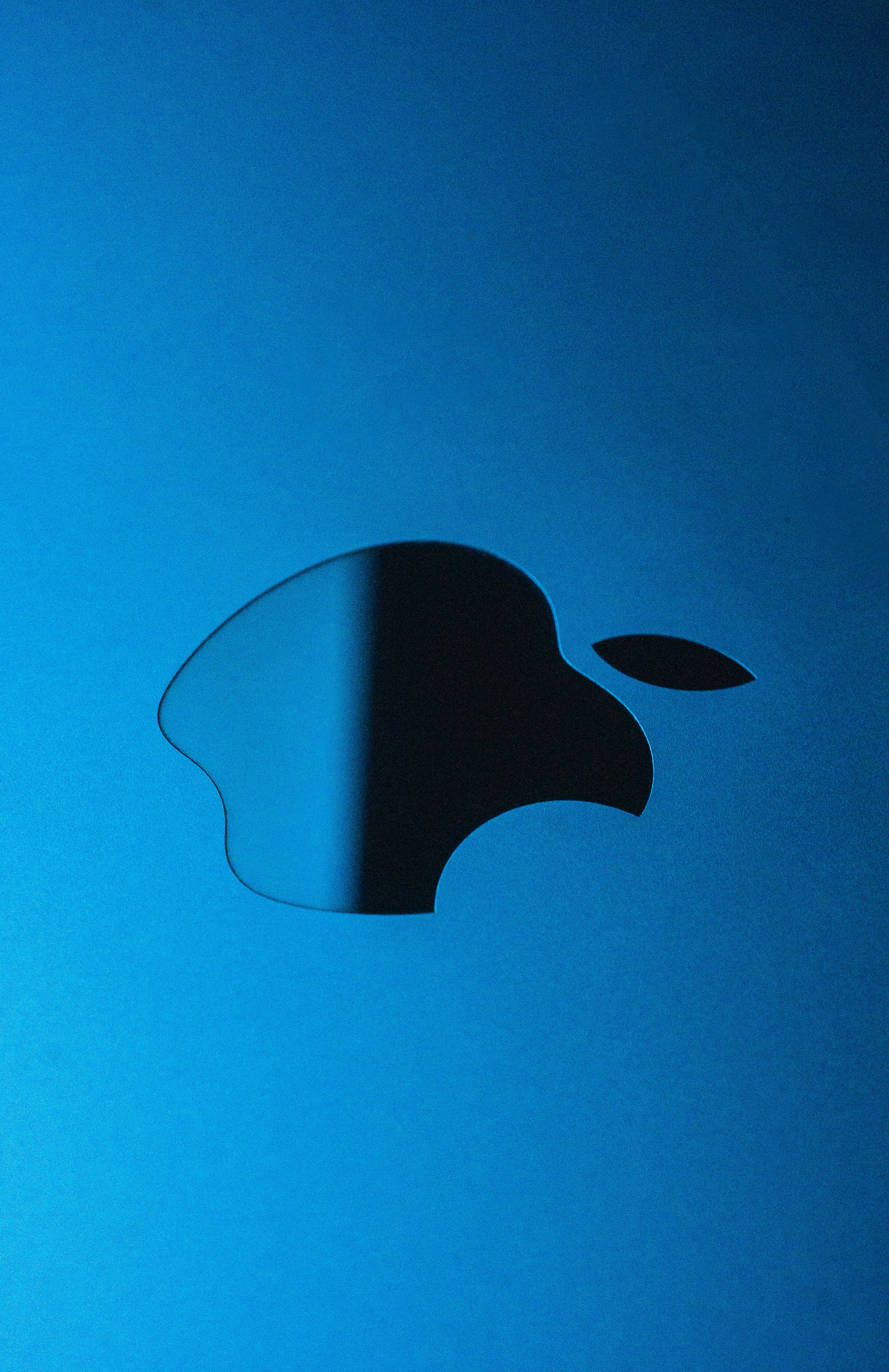 an apple logo is shown on a blue background
