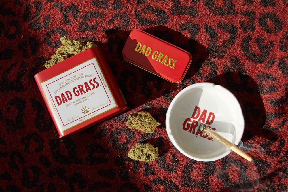 a box of dad grass next to a bowl of cereal