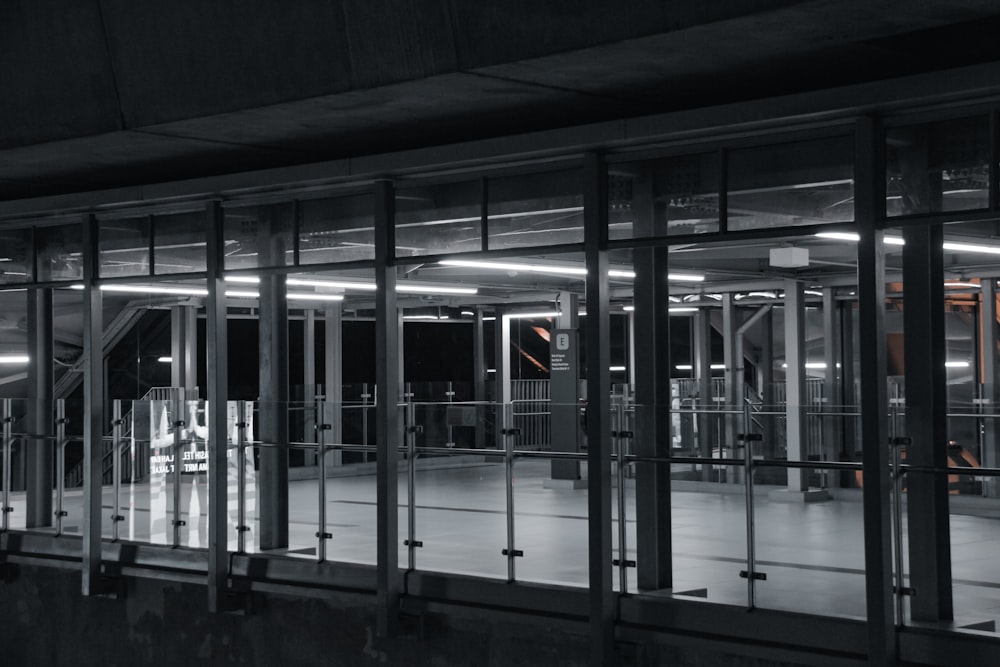 an empty parking garage at night with lights on