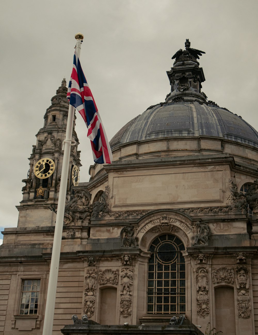 a british flag flying in front of a building