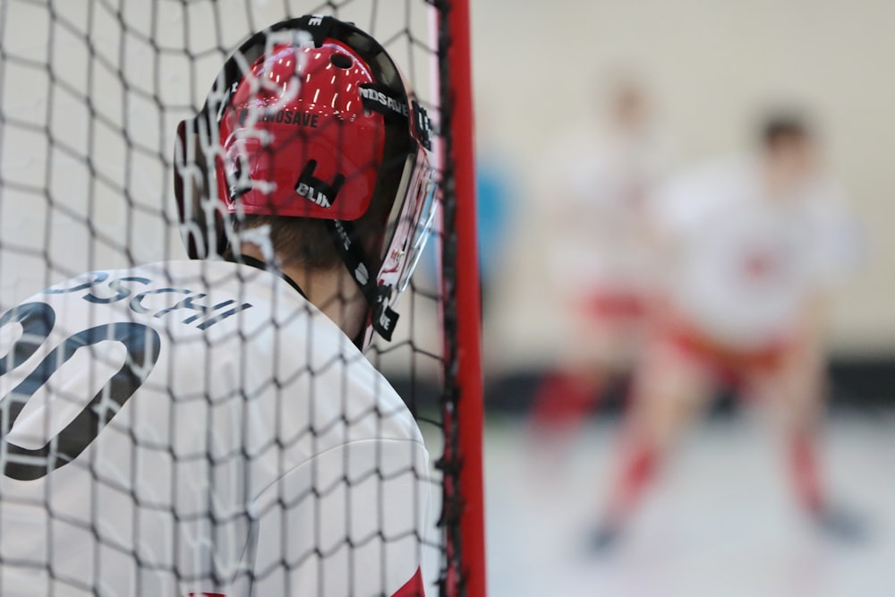 a close up of a goalie's helmet on the back of a hockey