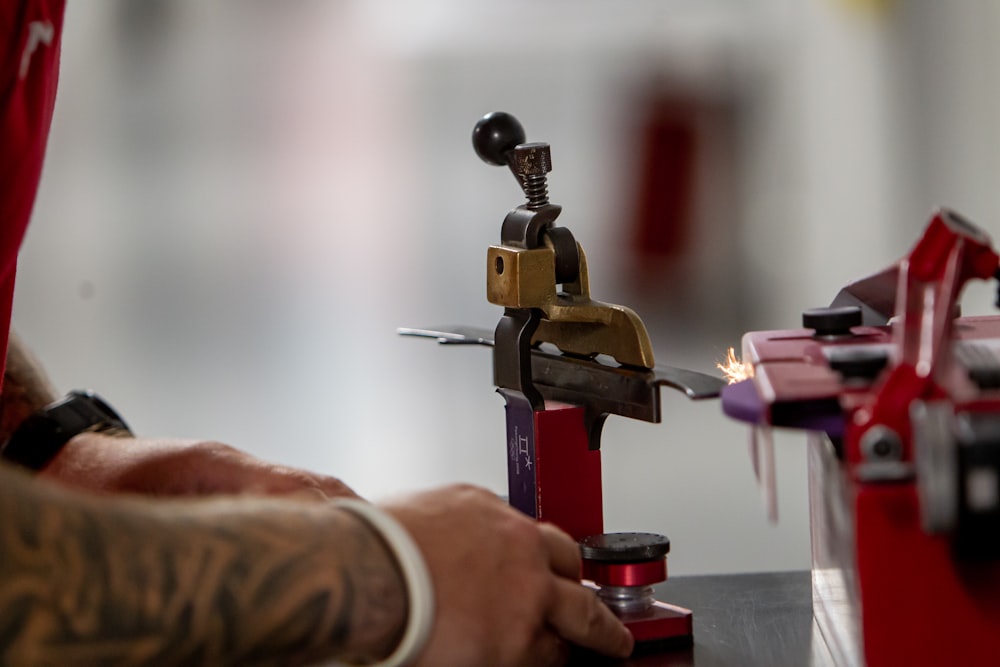 a man is working on a machine with a flame