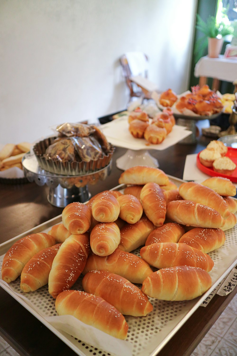 a table full of breads and pastries on it