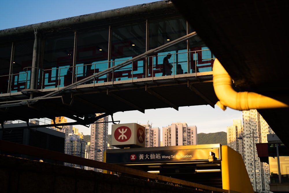 a pedestrian bridge over a busy city street