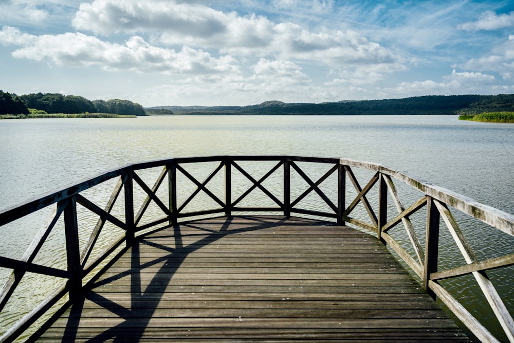a wooden bridge over a large body of water
