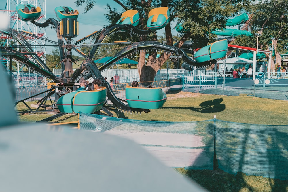 a ride at a carnival with people riding on it