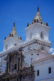 a church with a clock on the front of a building