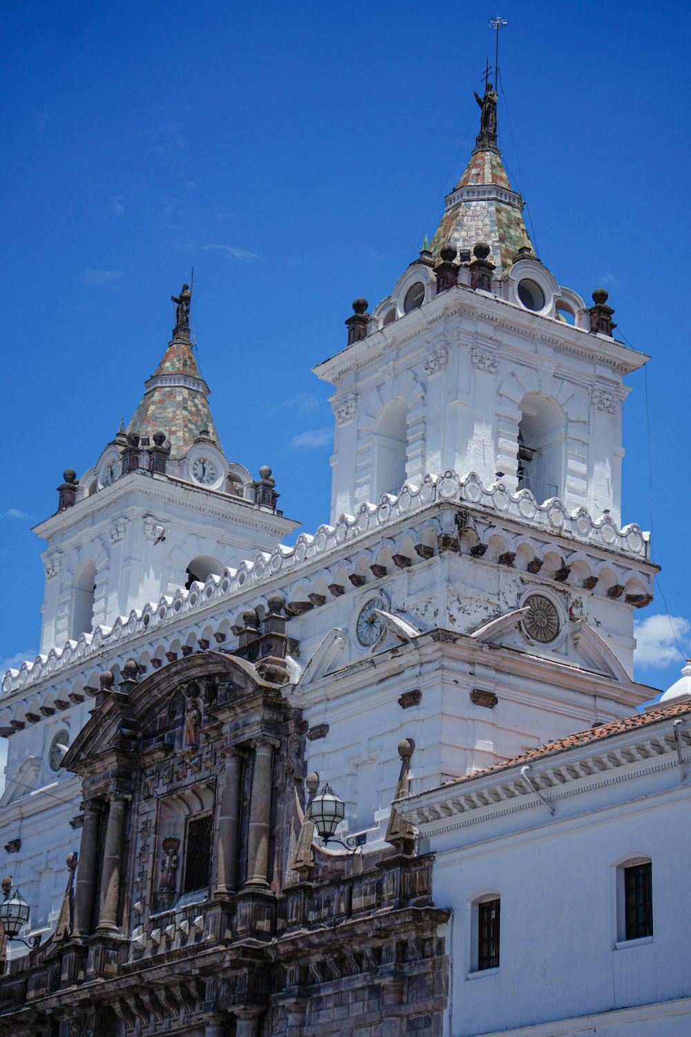 a church with a clock on the front of a building