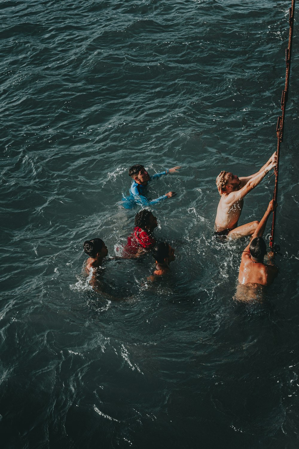 a group of people standing in the water