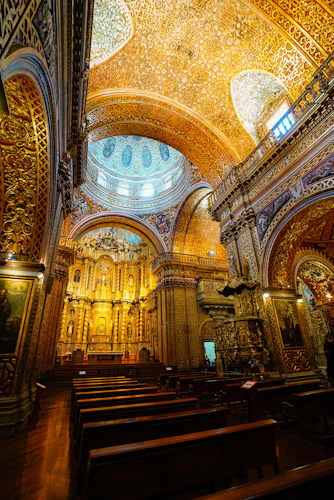 La Compañía interior: gold arches, dome, and ornate ceiling