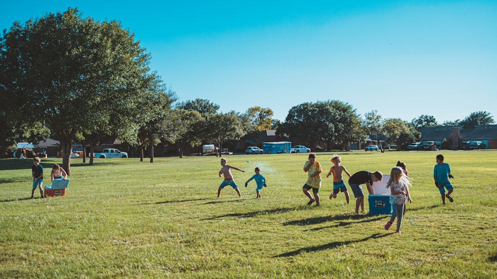 a group of people playing a game of frisbee