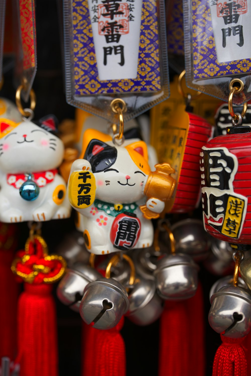 a close up of a bunch of bells with cats on them