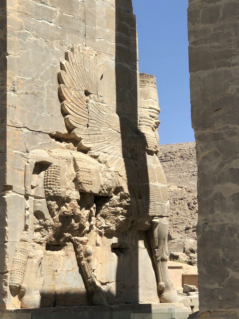 a statue of a man riding a horse in front of a building