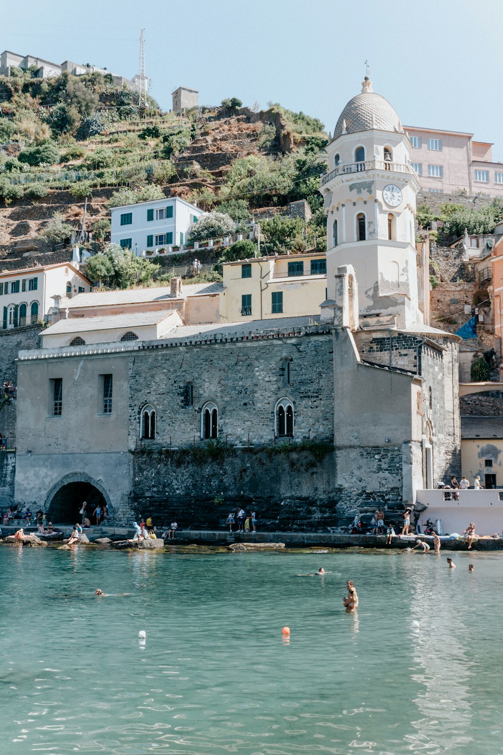 a group of people swimming in a body of water