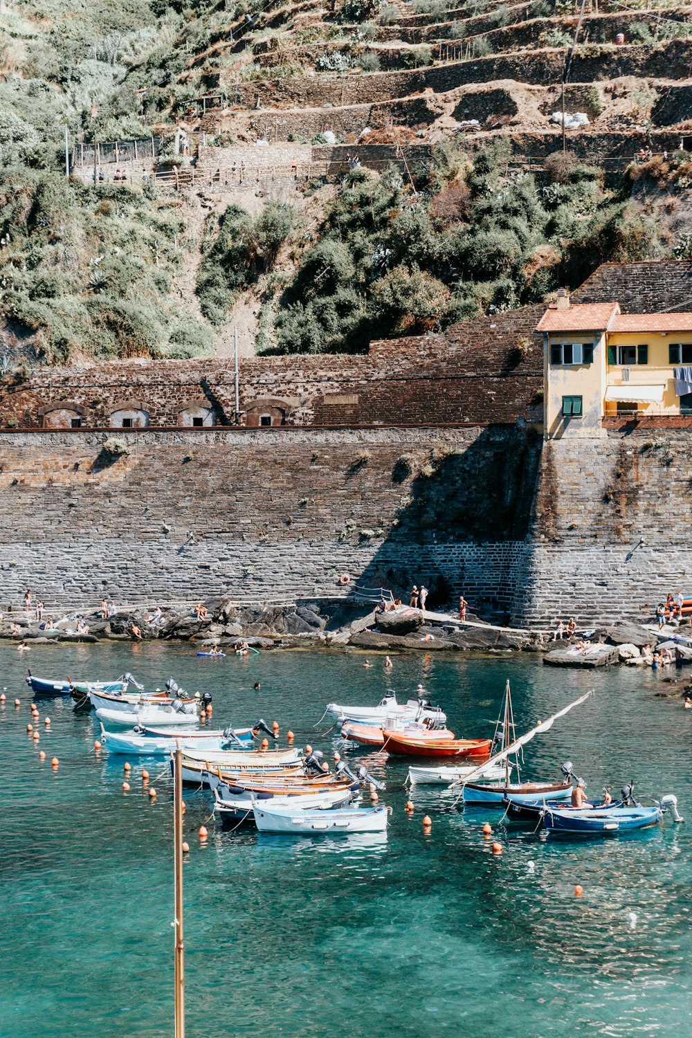 a group of boats floating on top of a body of water