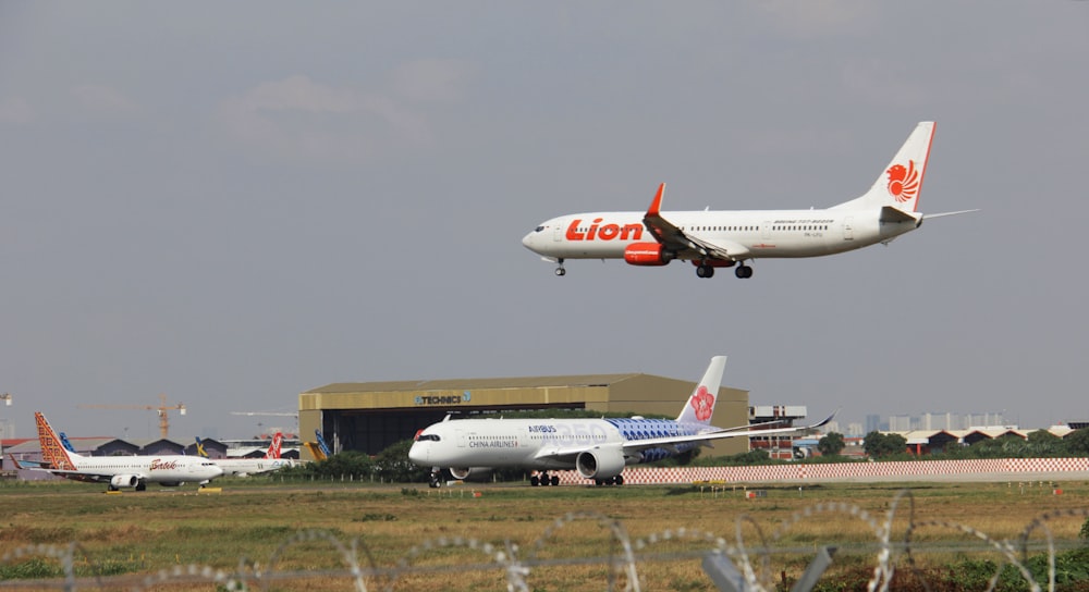 a large jetliner flying through a cloudy sky