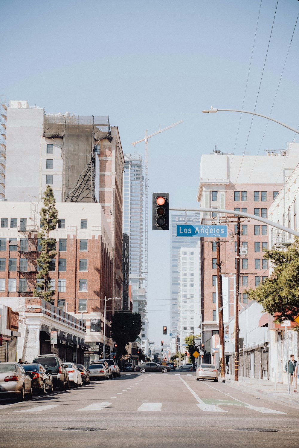 a traffic light hanging over a city street