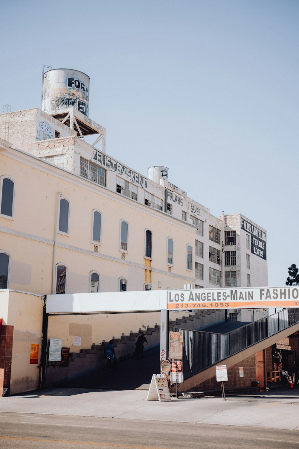 a large building with a sign that says los angeles - main fashion district